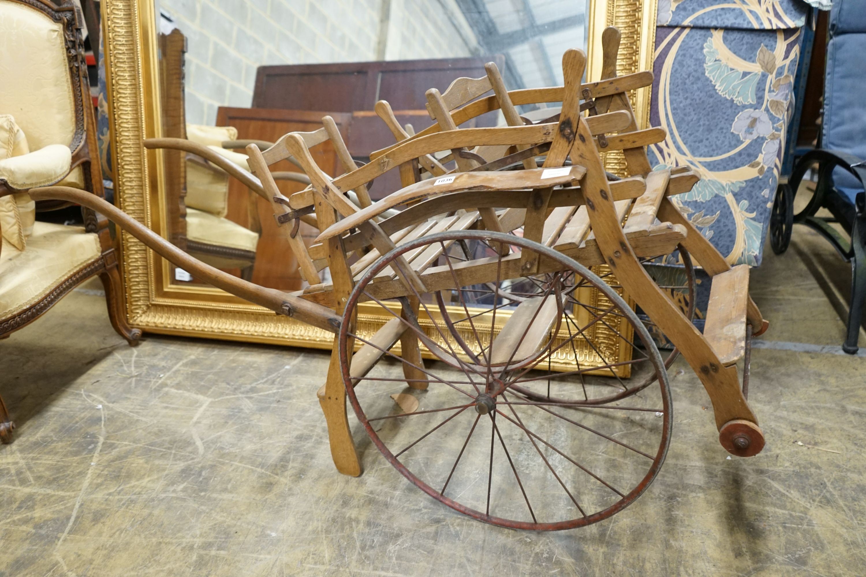 A small oak and pine twin seat cart, width 48cm, length 150cm